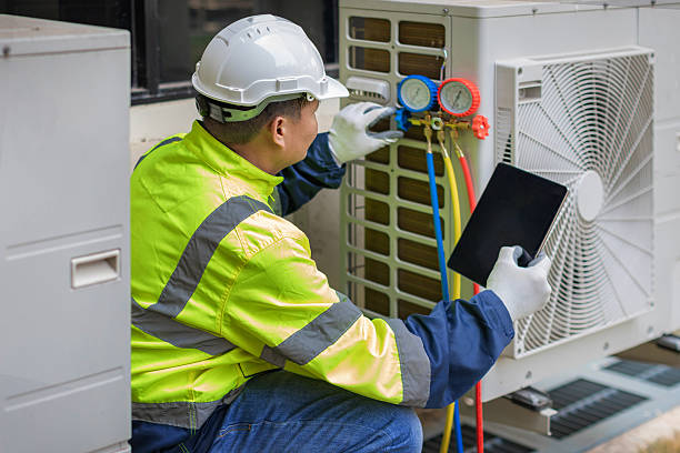 Professional Heat Pump Repair technician working in Fresh Meadows, NY